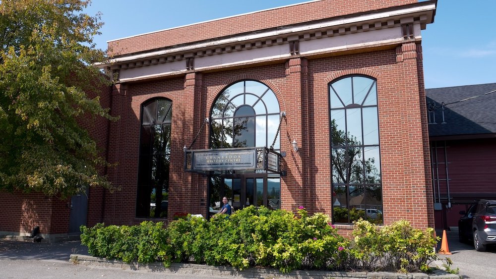 Cranbrook History Centre in Cranbrook, British Columbia, showing the brick museum exterior with large arched windows, highlighting a key cultural stop where visitors learn about railway history, local heritage, and the city’s role in regional travel.
