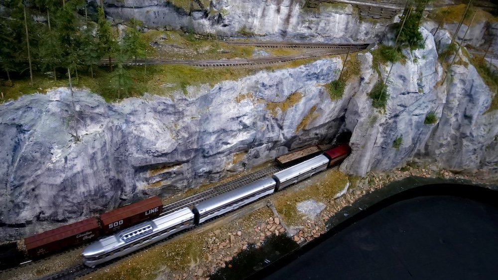 Family-friendly model train display at the Cranbrook History Centre in British Columbia Cranbrook History Centre in British Columbia featuring a detailed model train display winding through miniature mountain scenery, highlighting why this engaging indoor exhibit is a favorite family-friendly attraction for kids and parents visiting with babies or toddlers.
