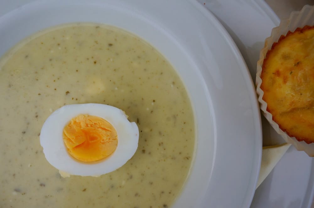 Close-up of a creamy Finnish soup topped with half a boiled egg, showing its smooth texture, gentle seasoning and simple presentation as part of a traditional comfort-food lunch in Finland.
