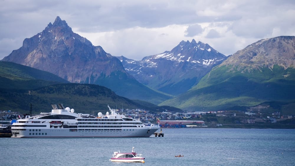 Cruise Ship Docked in Ushuaia Beneath the Mountains of Tierra del Fuego A cruise ship sits in the waters of Ushuaia beneath dramatic Andean peaks in Tierra del Fuego, Argentine Patagonia.