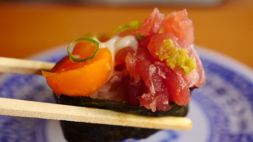 Delicious conveyor belt sushi macro details in Osaka, Japan 