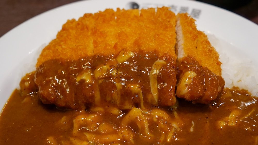 Delicious curry pork cutlet macro details served at Curry House CoCo Ichibanya in Niigata, Japan 