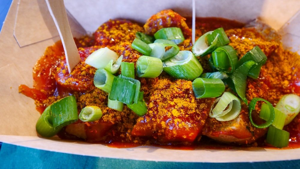 Delicious currywurst street food snack in Berlin, Germany 