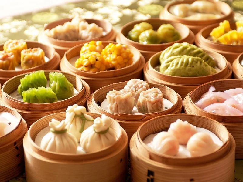 Dim sum served in traditional baskets with an assortment of varieties 