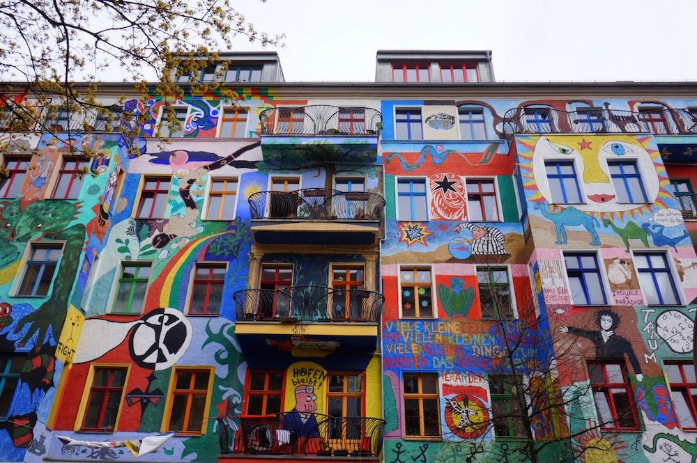 Distinct apartment buildings tagged with graffiti and street art in Berlin, Germany 