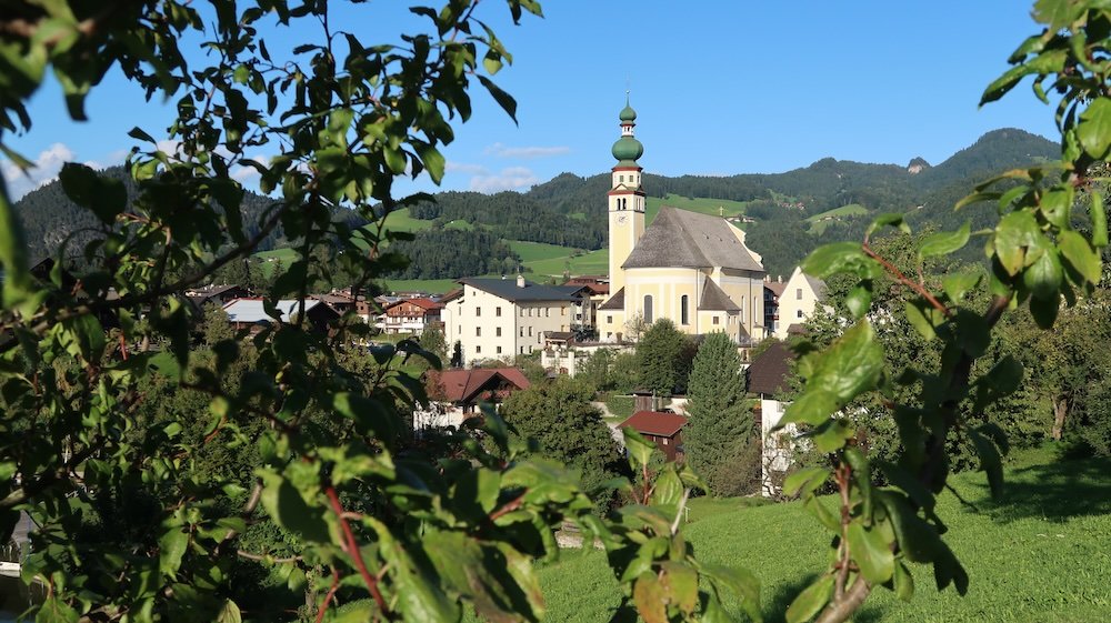 Distinct building framed through foliage in Tyrol, Austria 