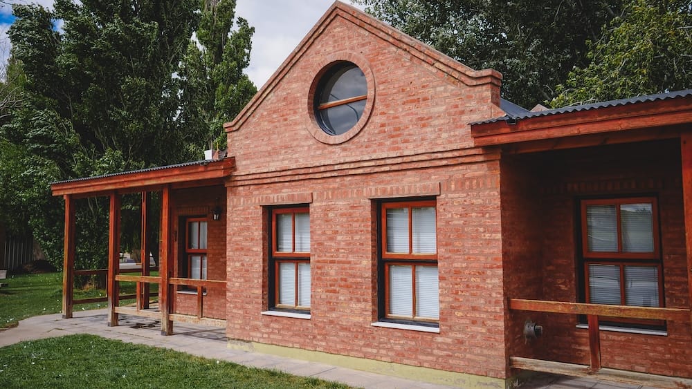 Traditional red brick Welsh-style building in Dolavon, Patagonia, showcasing simple architecture and design elements brought by Welsh settlers, reflecting how their cultural identity continues to shape towns in southern Argentina.