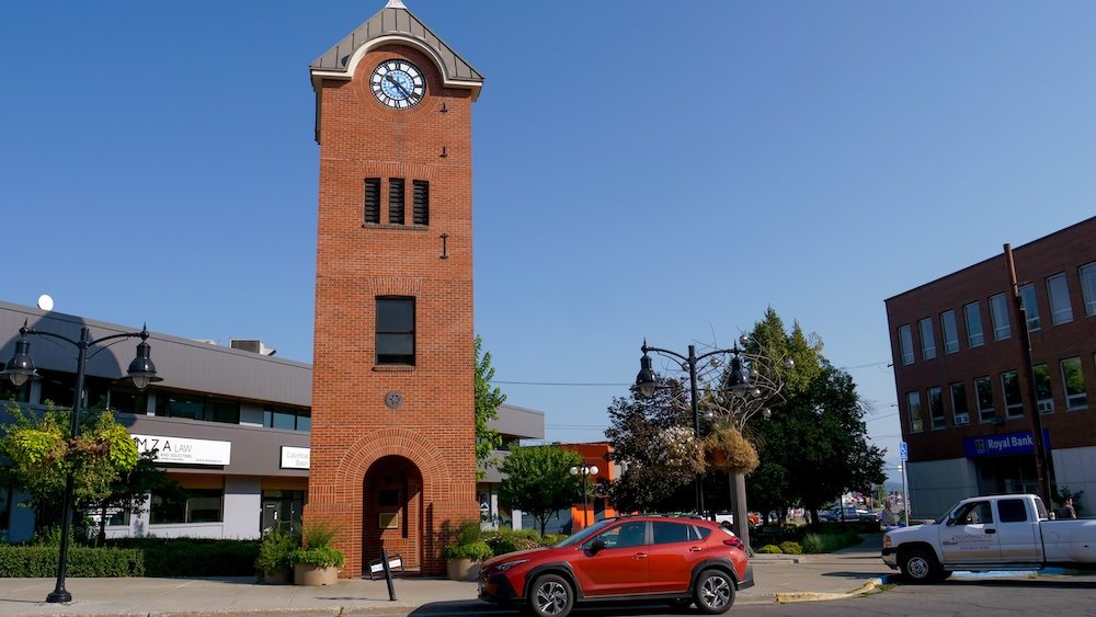 Downtown Cranbrook in British Columbia, featuring a distinctive red-brick clock tower and surrounding streetscape, showcasing the city’s historic architecture and small-town character that visitors naturally spot while exploring Cranbrook on a relaxed day trip.
