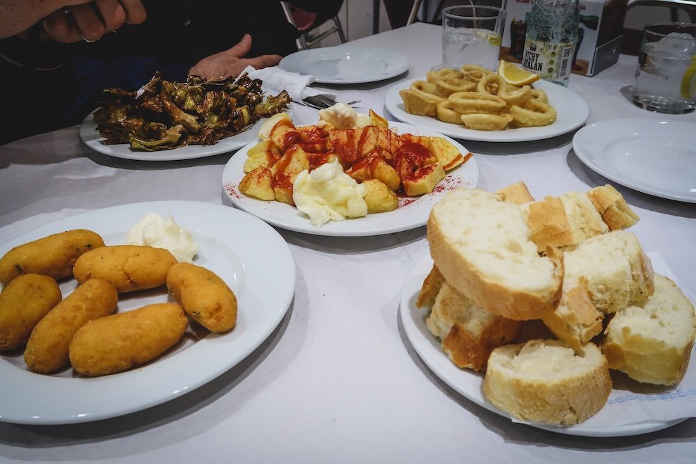 Eating tapas variety of small bites and dishes in Valencia, Spain 