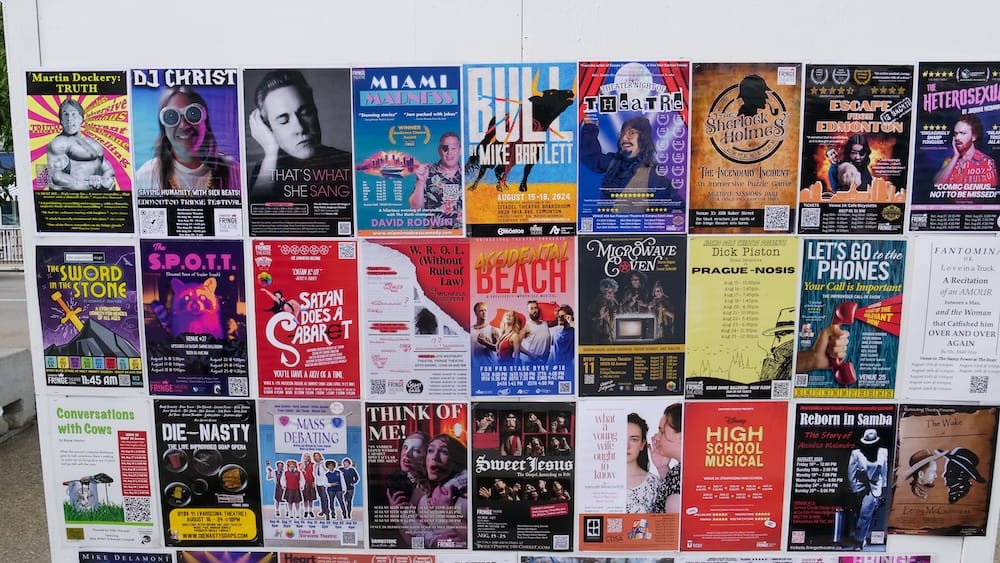 Wall of Fringe Festival show posters, Old Strathcona, Edmonton, Alberta, Canada A wall covered edge to edge with colorful Edmonton Fringe Festival show posters in Old Strathcona, Edmonton, Alberta, Canada, each advertising a different theatre production playing during the festival.
