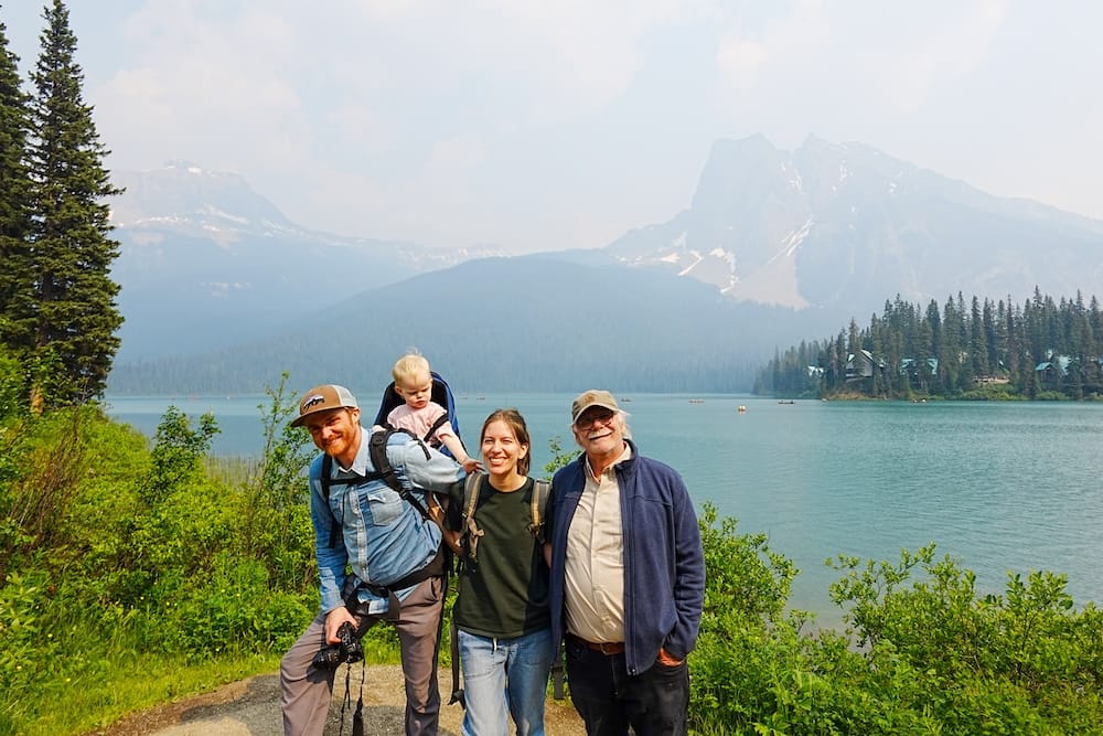Family at Emerald Lake in Yoho National Park with Samuel Jeffery, Audrey Bergner, Aurelia Jeffery and Daniel Bergner Samuel Jeffery, Audrey Bergner, Aurelia Jeffery and Daniel Bergner pose beside Emerald Lake in Yoho National Park, British Columbia, Canada, with green water, forest and steep Canadian Rockies mountains behind them.