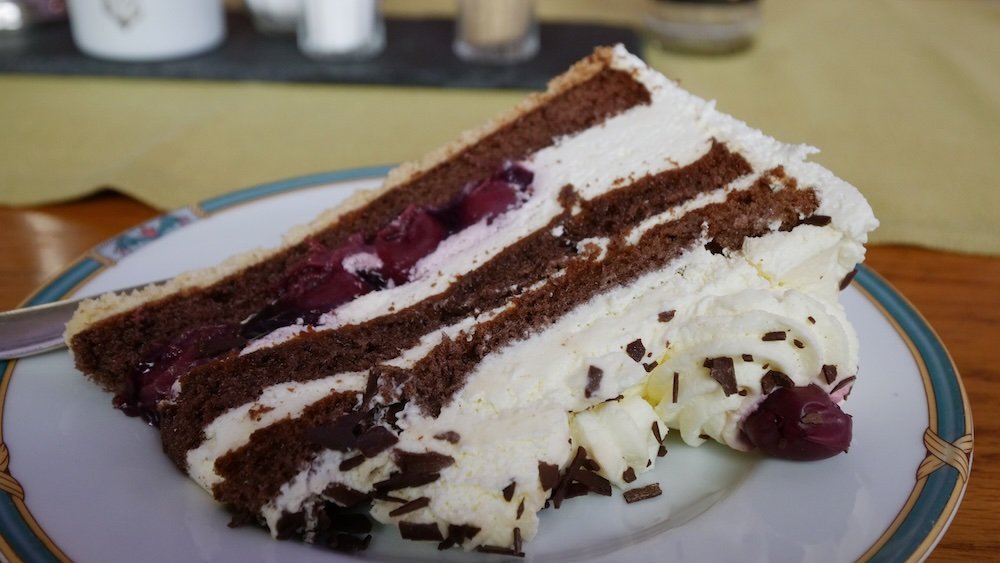 Enjoying a slice of Black Forest Cake at Dom-Hotel at Sankt Blasien in the Black Forest, Germany