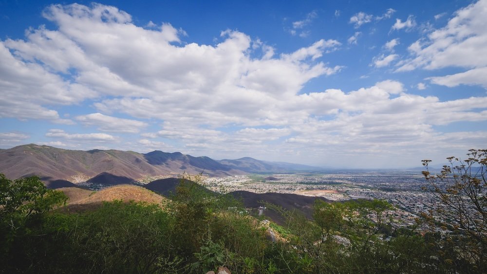 Epic Salta views from a high vantage point featuring city, mountains and clouds in Argentina 