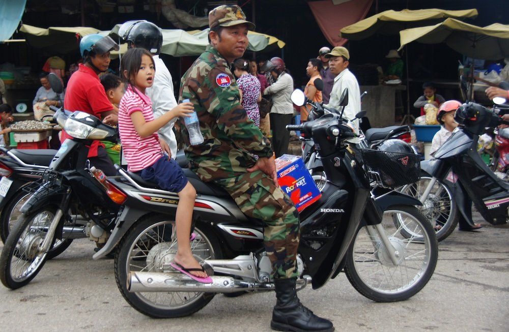 Family on motorcycle in Battambang, Cambodia 