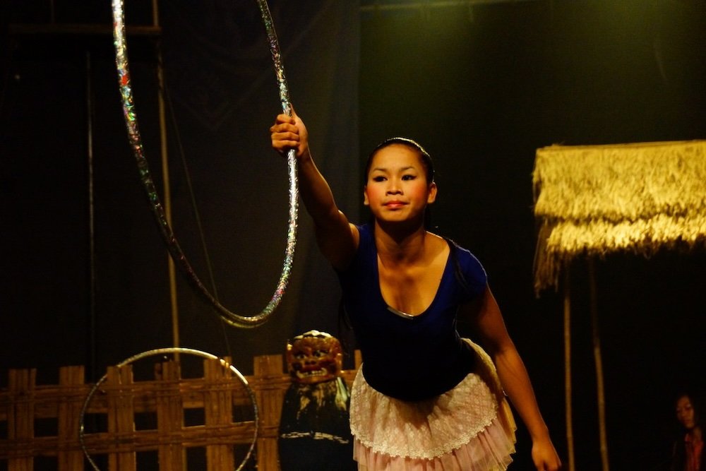 Female Cambodian performer with hoop at the Phare Ponleu Selpak Circus in Battambang, Cambodia