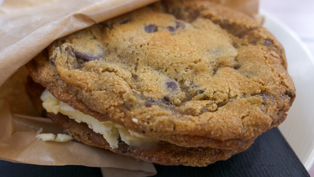 Ice cream sandwich with salted caramel at Bear Bistro in Fernie, BC Fernie, British Columbia, close-up of an ice cream sandwich made with homemade chocolate chip cookies and salted caramel ice cream at Bear Bistro in Island Lake Lodge, showcasing one of the most indulgent dessert stops during a Fernie food-focused trip.