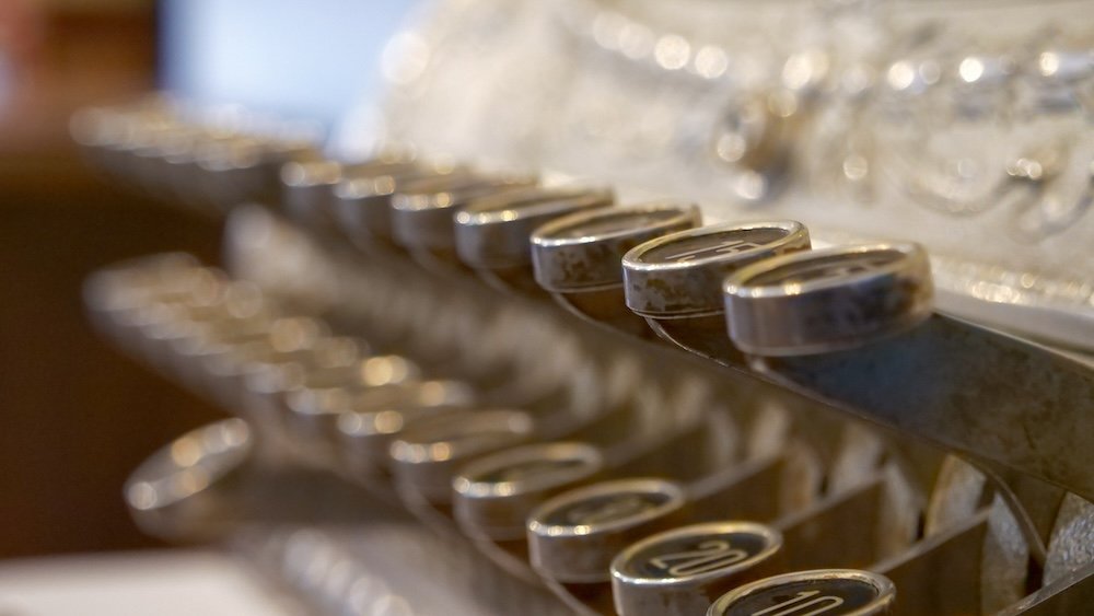 Vintage typewriter exhibit at the Fernie Museum Fernie, British Columbia museum detail showing a close-up row of vintage typewriter keys on display inside the Fernie Museum, highlighting everyday artifacts that tell the story of early town life and local history in this mountain community.