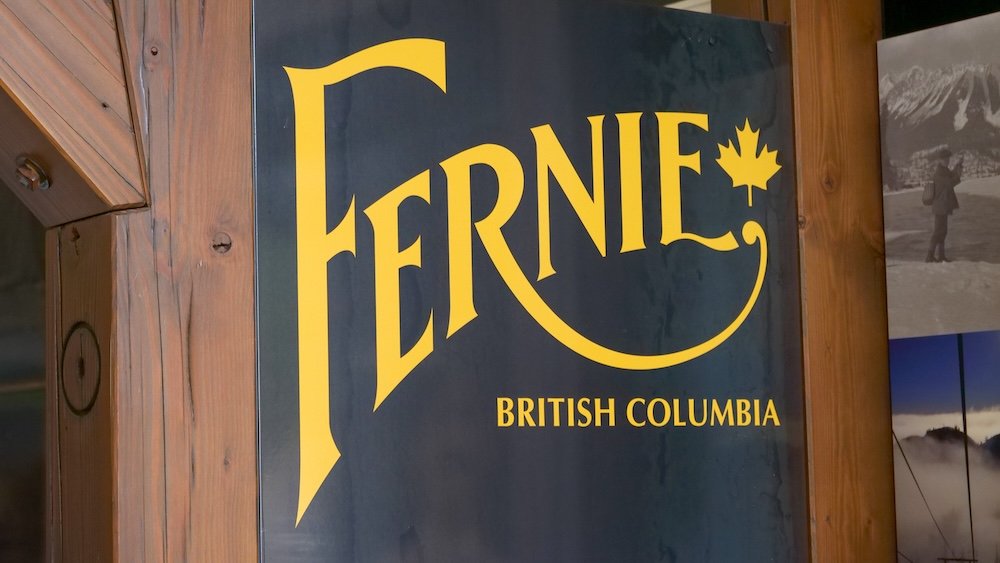 Fernie Museum sign display in British Columbia Fernie, British Columbia sign display inside the Fernie Museum, with bold yellow lettering on a dark background and a small maple leaf—an easy first stop to get context on the town’s mining, fires, and reinvention.