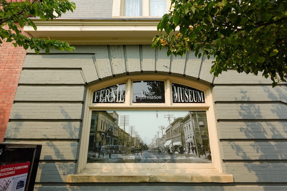 Fernie Museum in Fernie, British Columbia with historic streetscape imagery displayed in the front window, making it an ideal first stop for orientation, local history, and context when beginning a two-day Fernie itinerary.