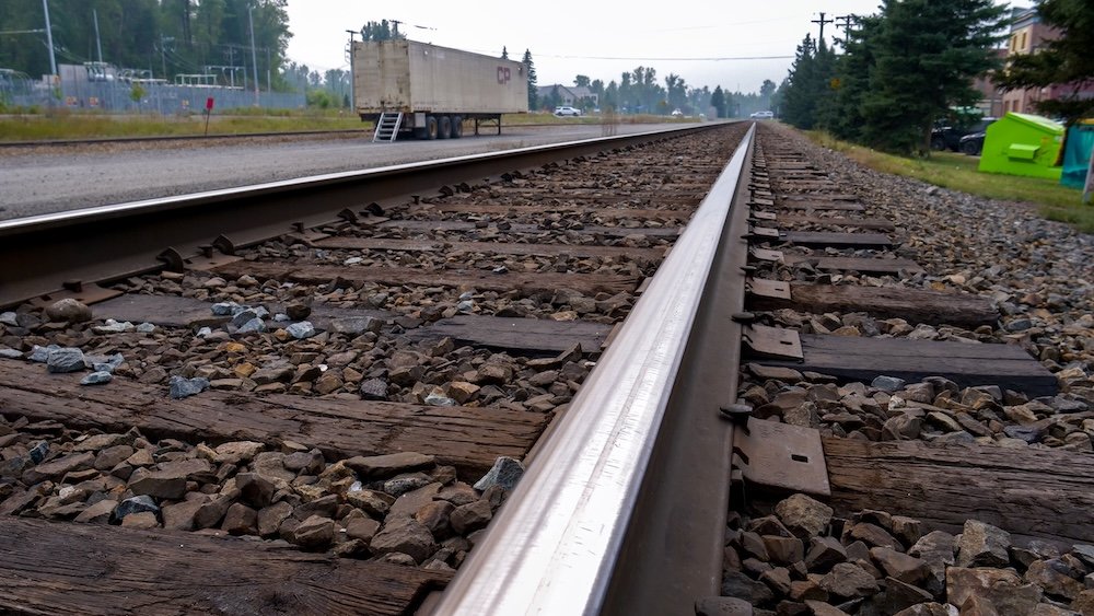 Historic Train Tracks in Fernie, British Columbia Fernie, British Columbia railway tracks stretching through town, photographed at ground level to show steel rails, wooden ties, and gravel ballast that reflect Fernie’s historic rail heritage and industrial roots within the Elk Valley landscape.