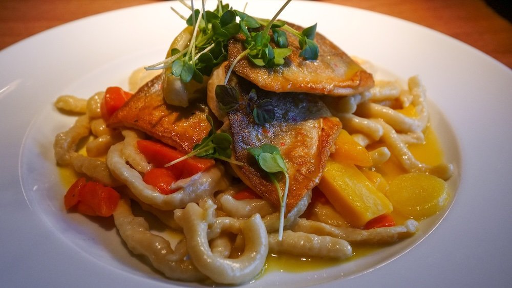 Fish, noodles and vegetables dish in Schwerin, Germany 