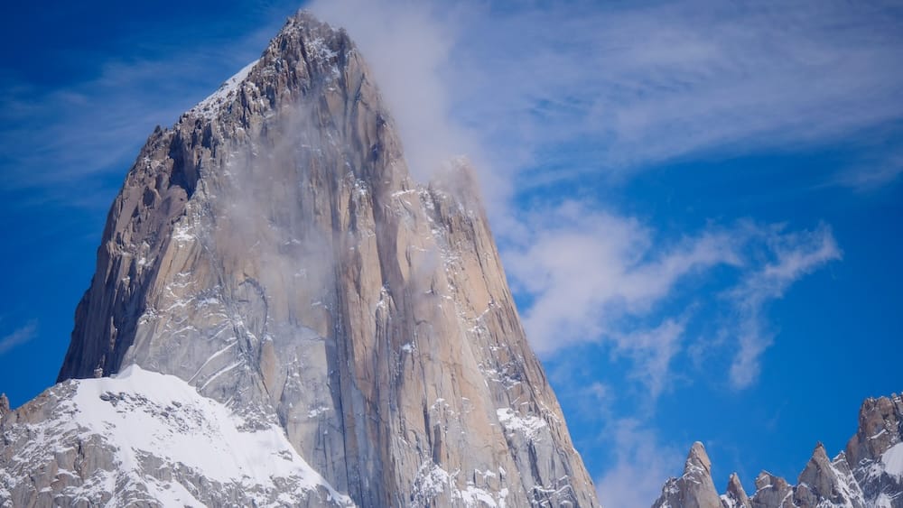 Zoomed in view of Fitz Roy summit in El Chalten Patagonia where isolating the peak removes surrounding scale references making the mountain appear less massive in photos than it feels when experienced in person