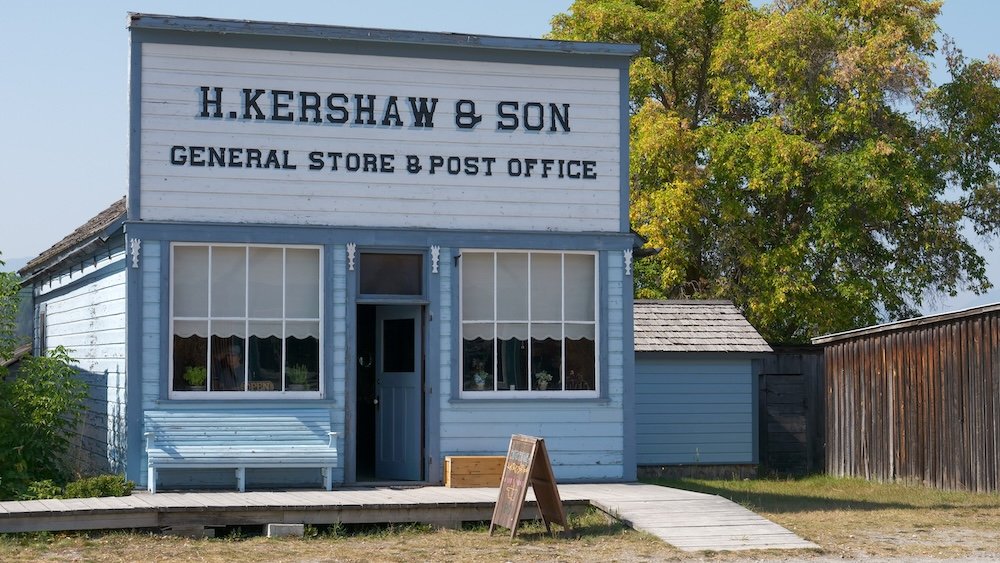 H. Kershaw & Son General Store and Post Office at Fort Steele Heritage Town near Cranbrook, BC, showing the preserved wooden storefront and boardwalk that illustrate everyday commerce, mail service, and community life in a historic boomtown.