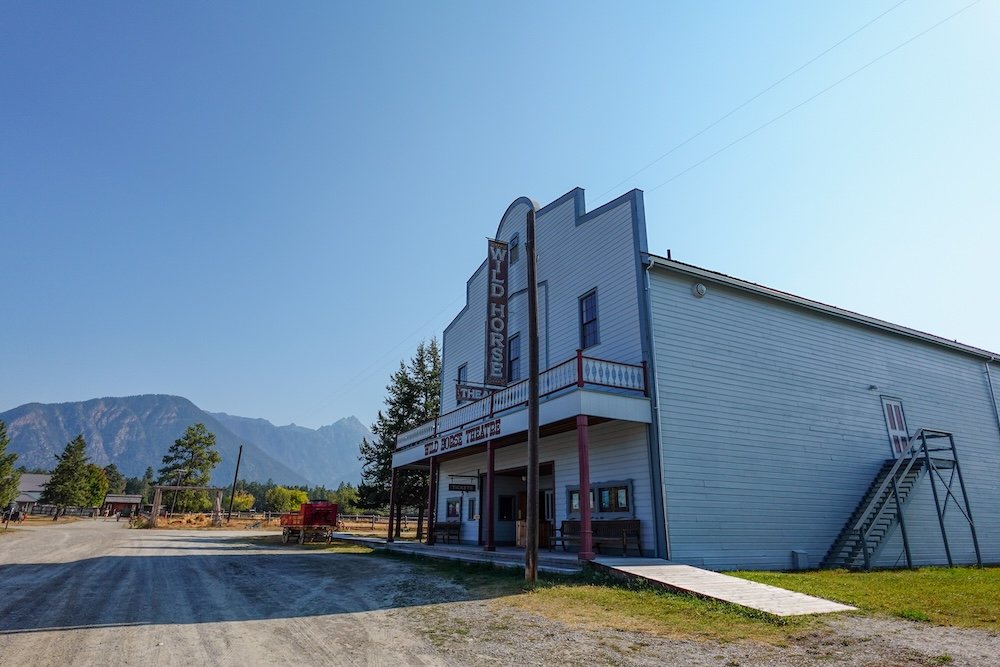 Fort Steele Heritage Town, British Columbia: the Wild Horse Theatre historic wooden building with classic frontier-style architecture, part of the preserved gold rush–era town that brings late-1800s life and entertainment history to visitors.