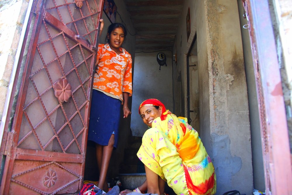 Friendly locals greeting me at their door in Jodhpur, Rajasthan, India 