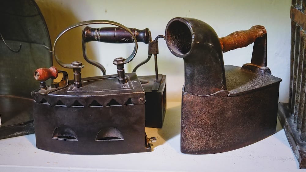 Historic iron tools displayed in a museum in Gaiman Patagonia Argentina, representing everyday life of early Welsh settlers who established communities in Chubut and preserved traditions like tea culture in harsh conditions