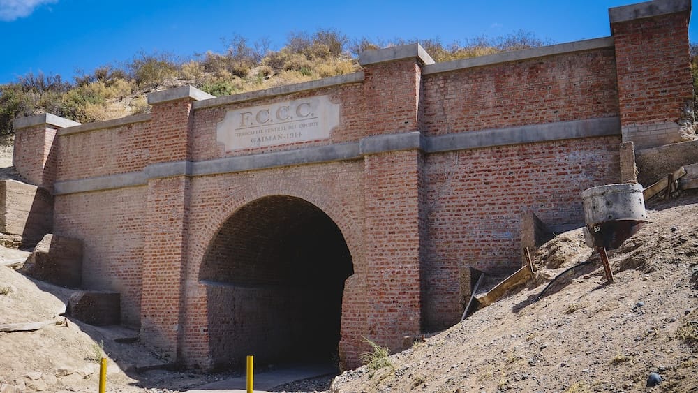 Gaiman railway tunnel Patagonia 1914 Welsh settlement infrastructure Chubut Valley Argentina Historic railway tunnel in Gaiman Patagonia Argentina built in 1914 after residents refused tracks through town center, highlighting Welsh settlement infrastructure, engineering adaptation, and the challenges of developing transport routes in Chubut Valley