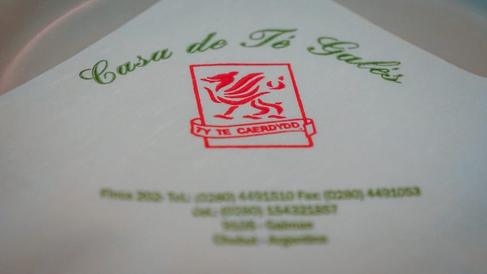 Gaiman Patagonia Ty Te Caerdydd Welsh tea house branding on a white napkin featuring the red Welsh dragon symbol representing Y Wladfa heritage and one of the most iconic tea houses for traditional merienda in Chubut Argentina
