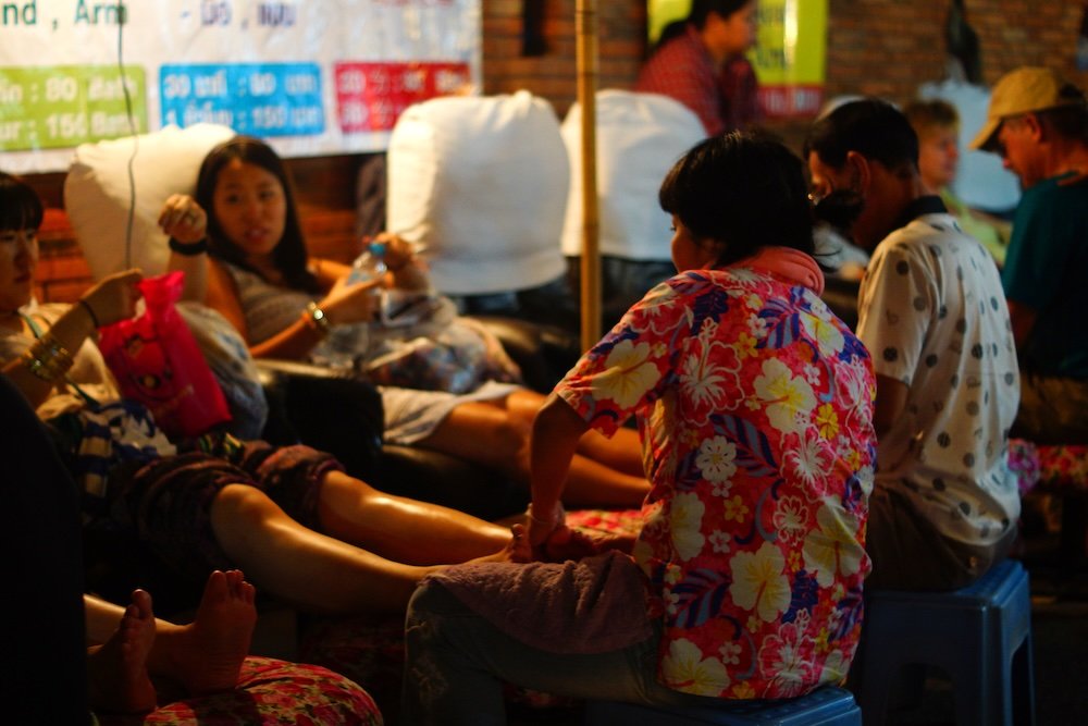 Getting a foot massage in Chiang Mai, Thailand as part of a health and wellness routine 