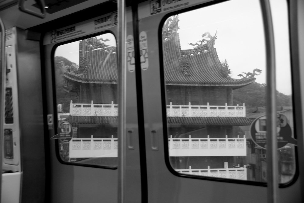 Greyscale taking the metro in Taipei, Taiwan 