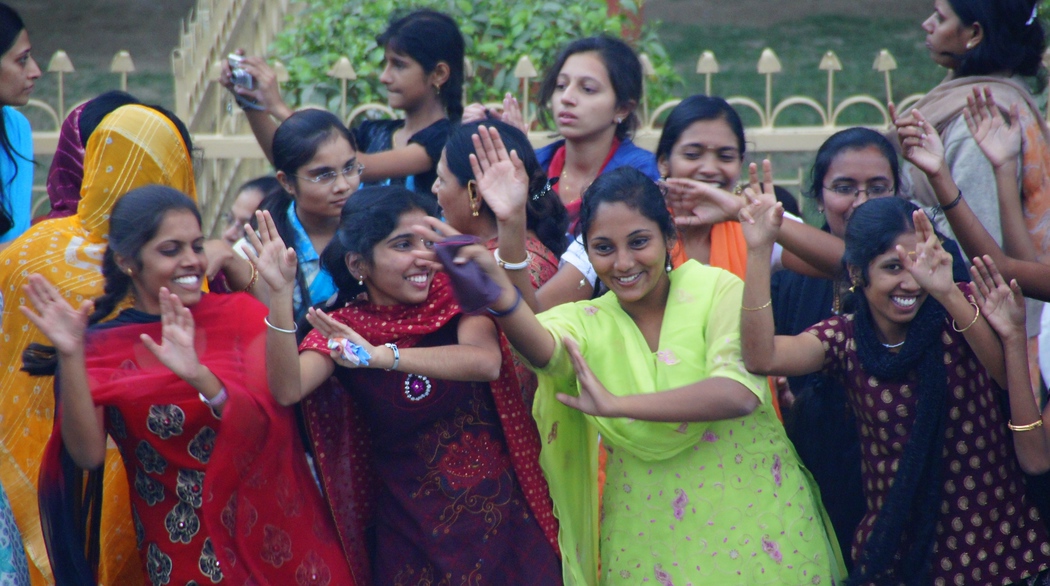 Group of Indian ladies dancing during the border closing ceremony between India and Pakistan 