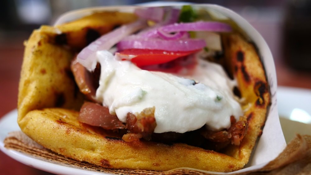 Gyro loaded with special sauce in Athens, Greece 