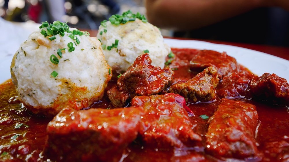 Hearty German meat and sauce with dumplings in Munich, Germany 