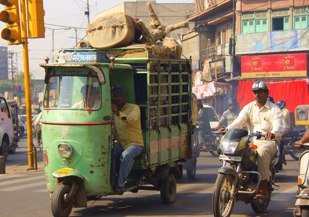 Hectic Jodhpur street scene with an auto rickshaw