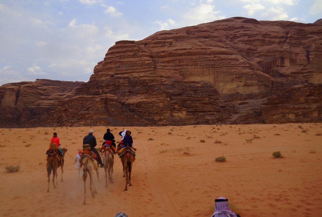 Here is another group shot of us riding camels in Wadi Rum, Jordan. Can you spot Audrey aka That Backpacker?