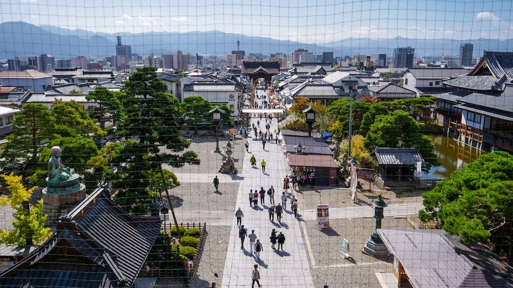 High vantage point views of pedestrians enjoying cultural Nagano city, Japan 