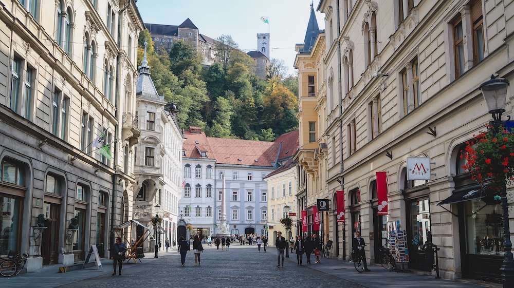 Historic walking tour with old buildings in Ljubljana, Slovenia 