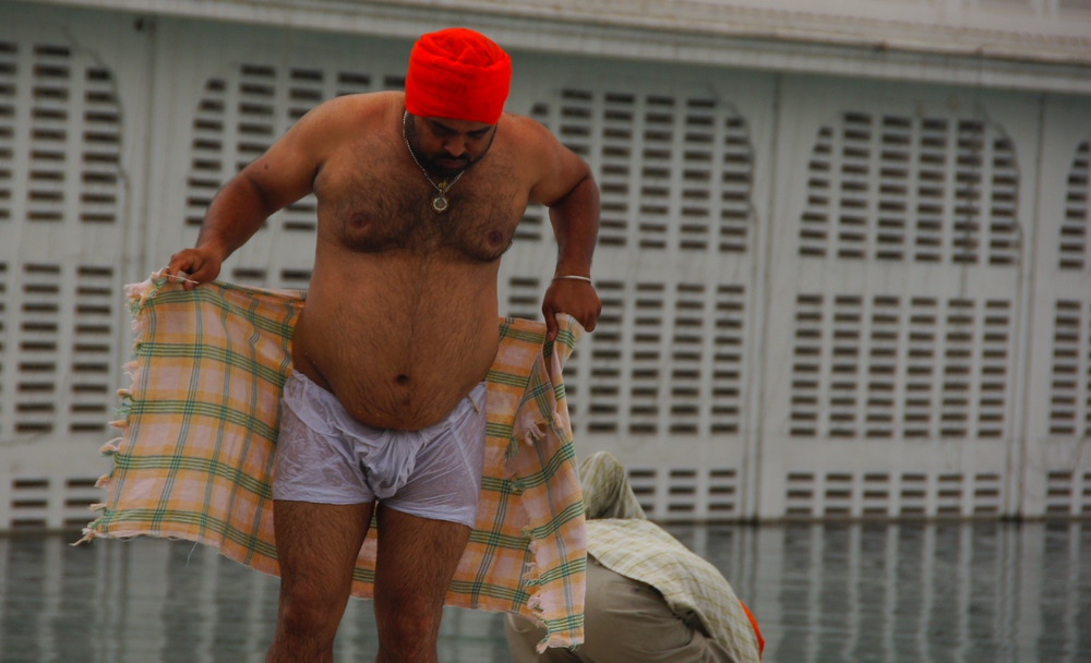 I snapped this candid portrait just after this man finished taking a dip in Golden Temple in Amritsar, India