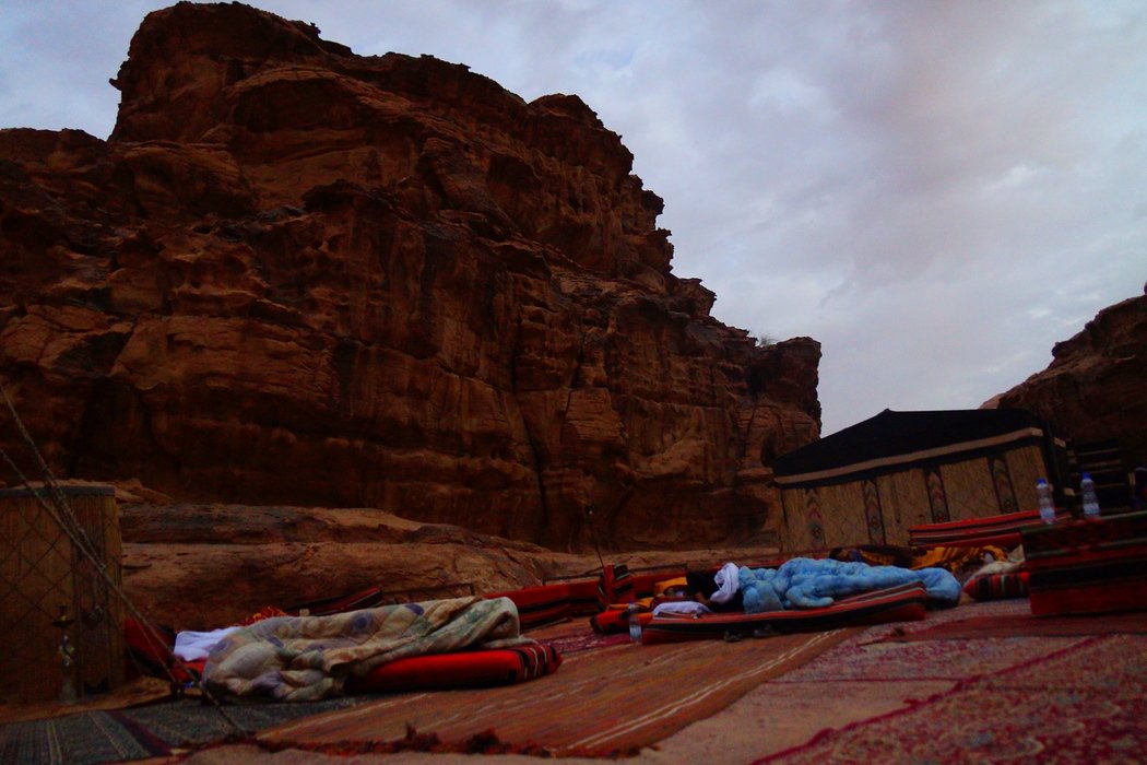 In this photo you can notice several mattresses that were used to sleep on around the camp fire at night in Wadi Rum