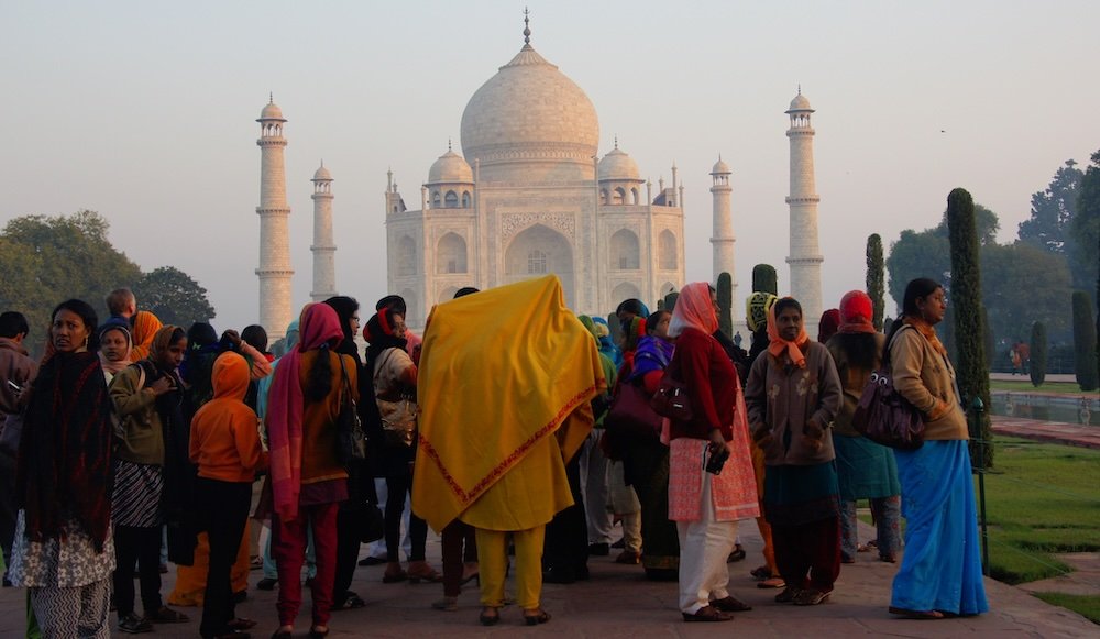 Incredible group of people observing the Taj Mahal in Agra, India