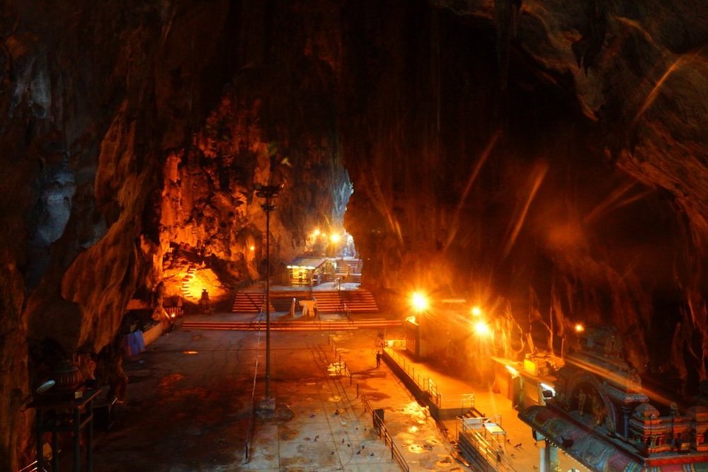 Inside the Batu Cave lit up yet dark 