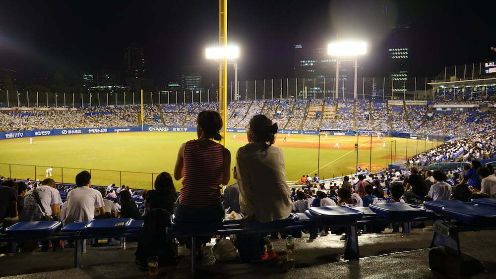Japan baseball stadium at night with fans watching the game in Tokyo