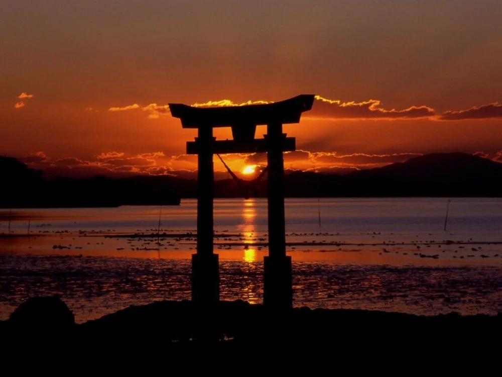 Sunset in Japan overlooking a traditional Japanese Tori Gate