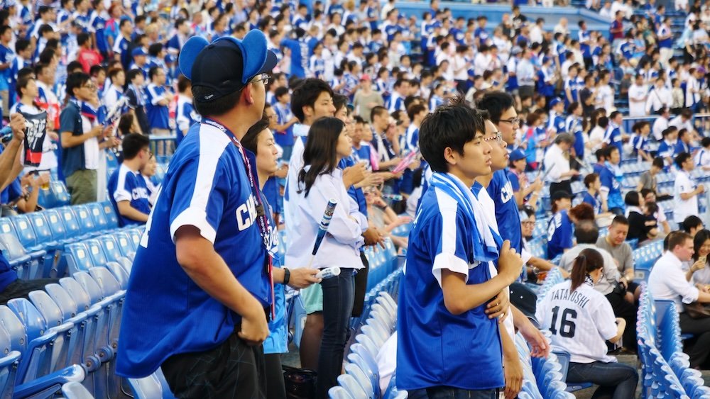 Japanese baseball fans cheering for their team in Tokyo, Japan 