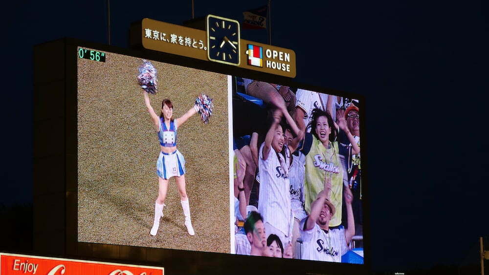 Japanese cheerleaders dancing during a baseball game in Japan 