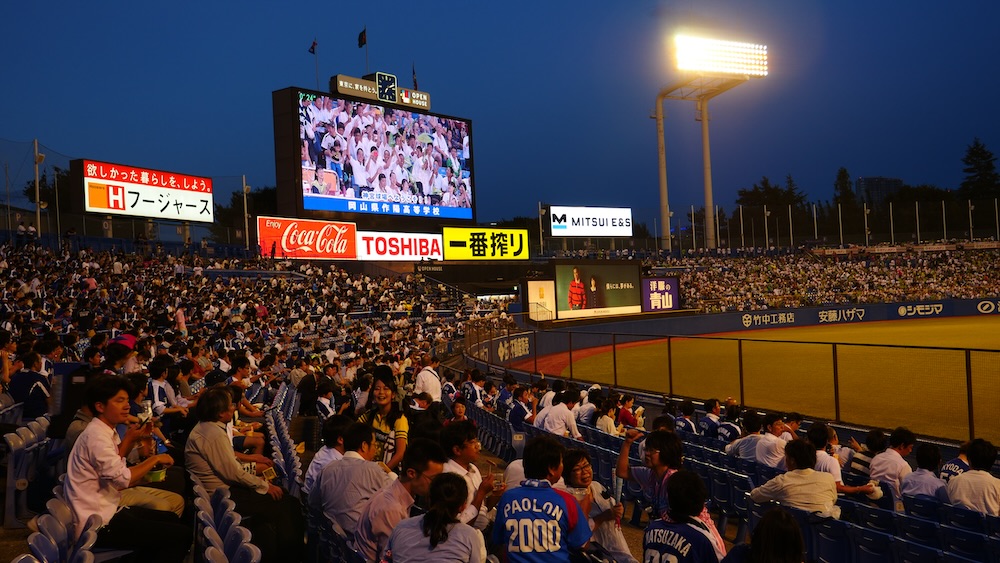 Japanese scoreboard with fans cheering at a baseball game in Tokyo, Japan 